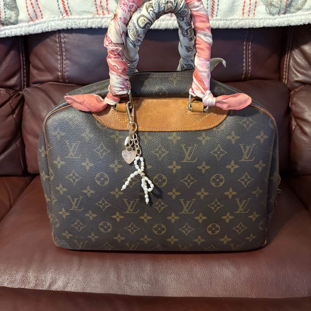 Brown Designer Handbag With Patterned Accents - image 2